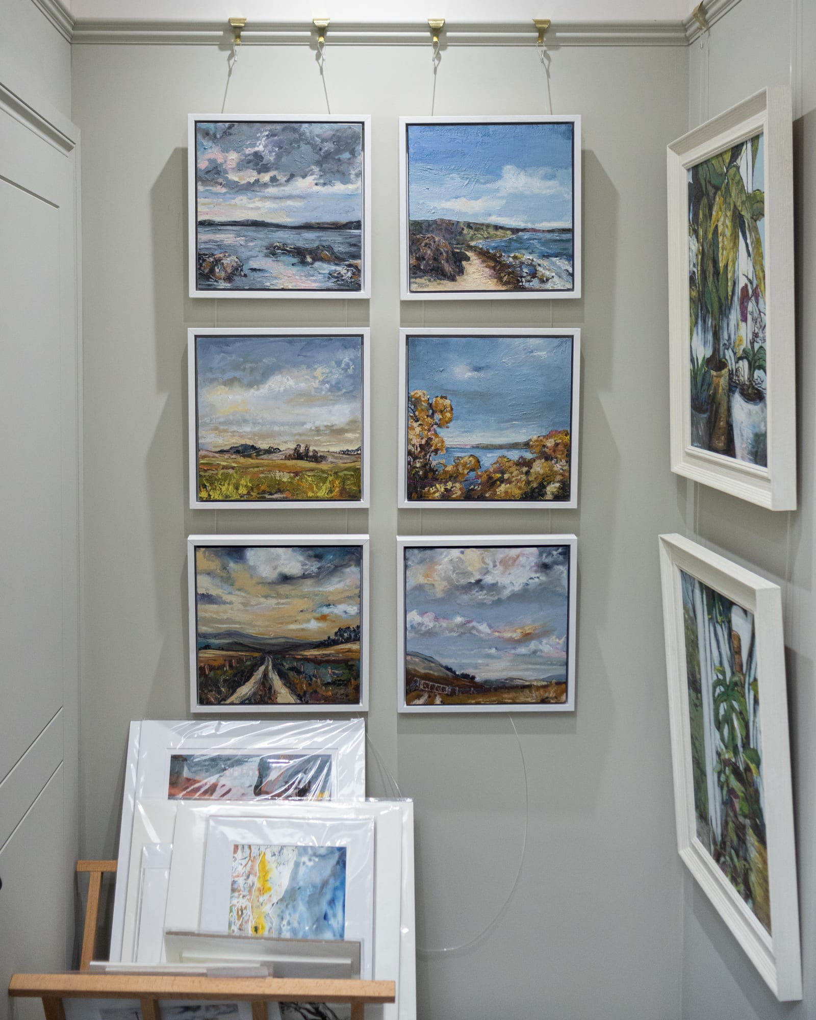 Framed landscape paintings by Virginia Maggio