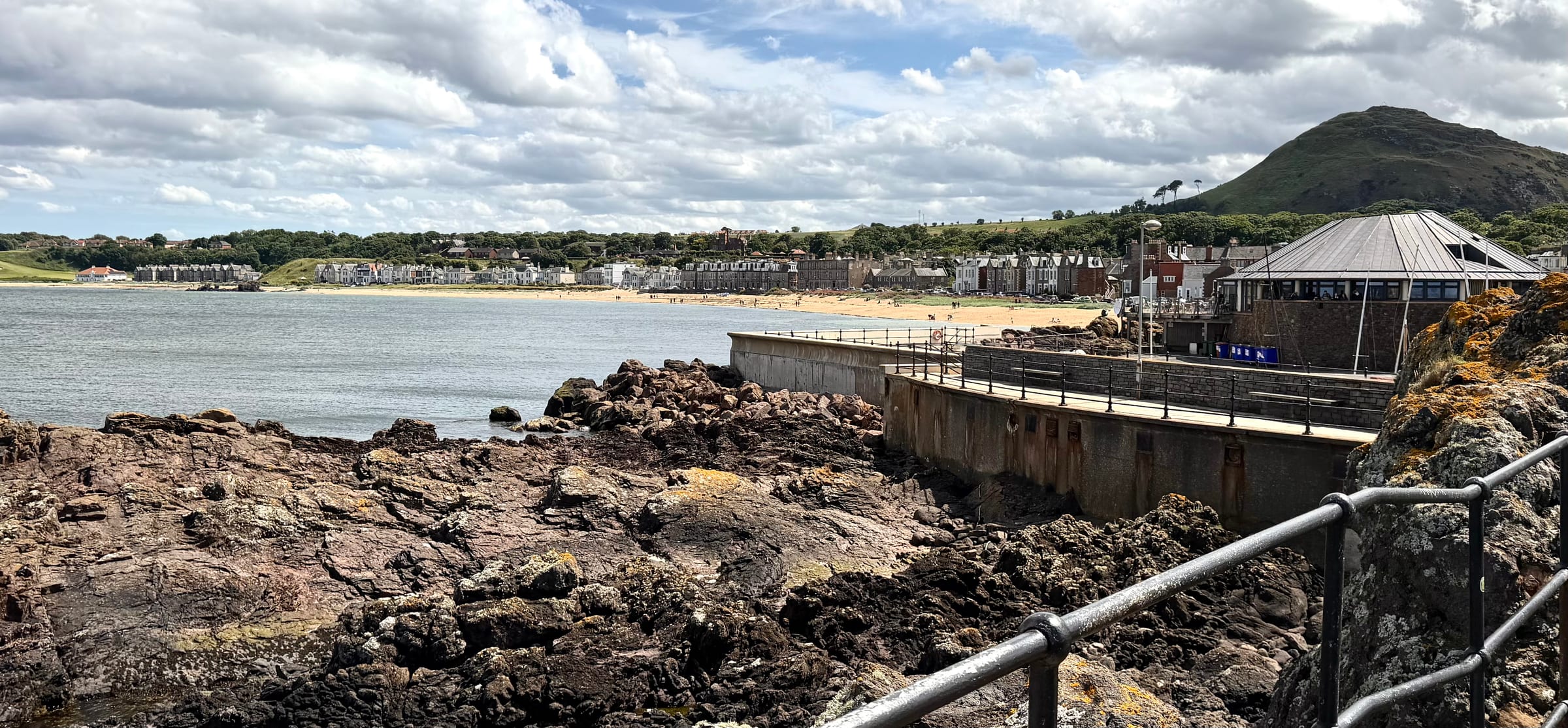 North Berwick harbour and beach with the Scottish Seabird Centre and North Berwick Law beyond